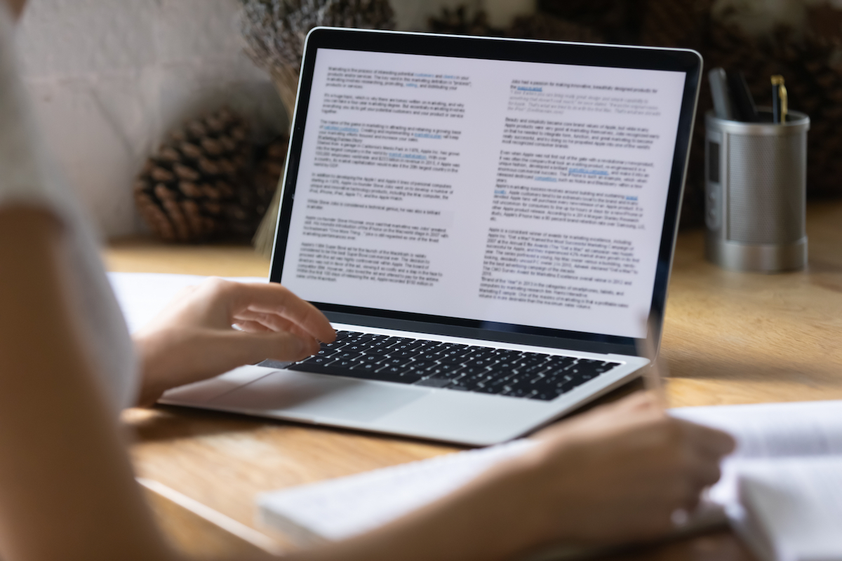 woman preparing report or reading scientific article