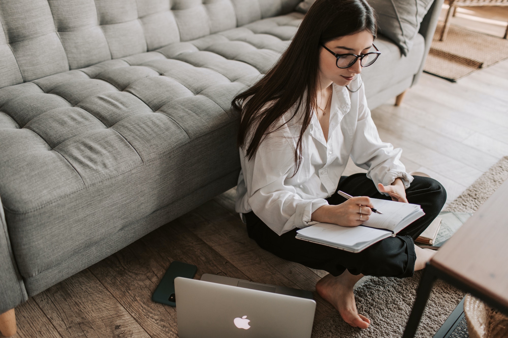 woman writing on notebook